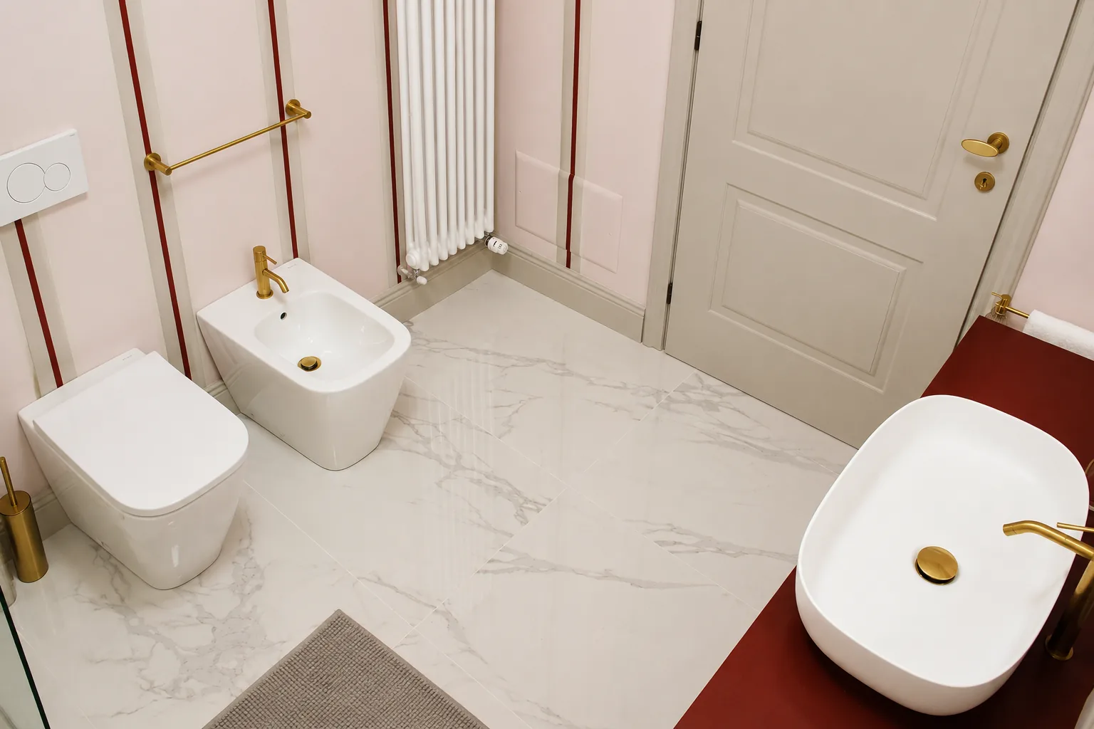 Pink en-suite bathroom seen from above