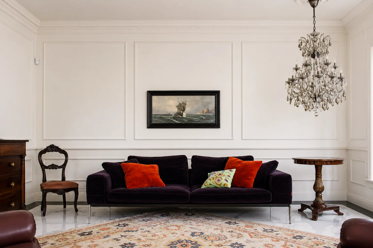 Sitting room with velvet sofa and crystal chandelier
