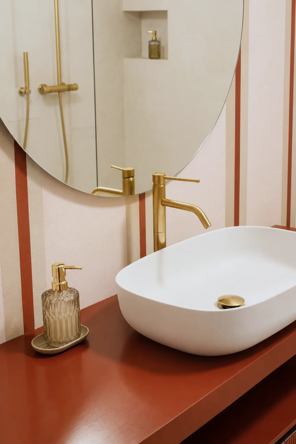 White washbasin and brass fittings