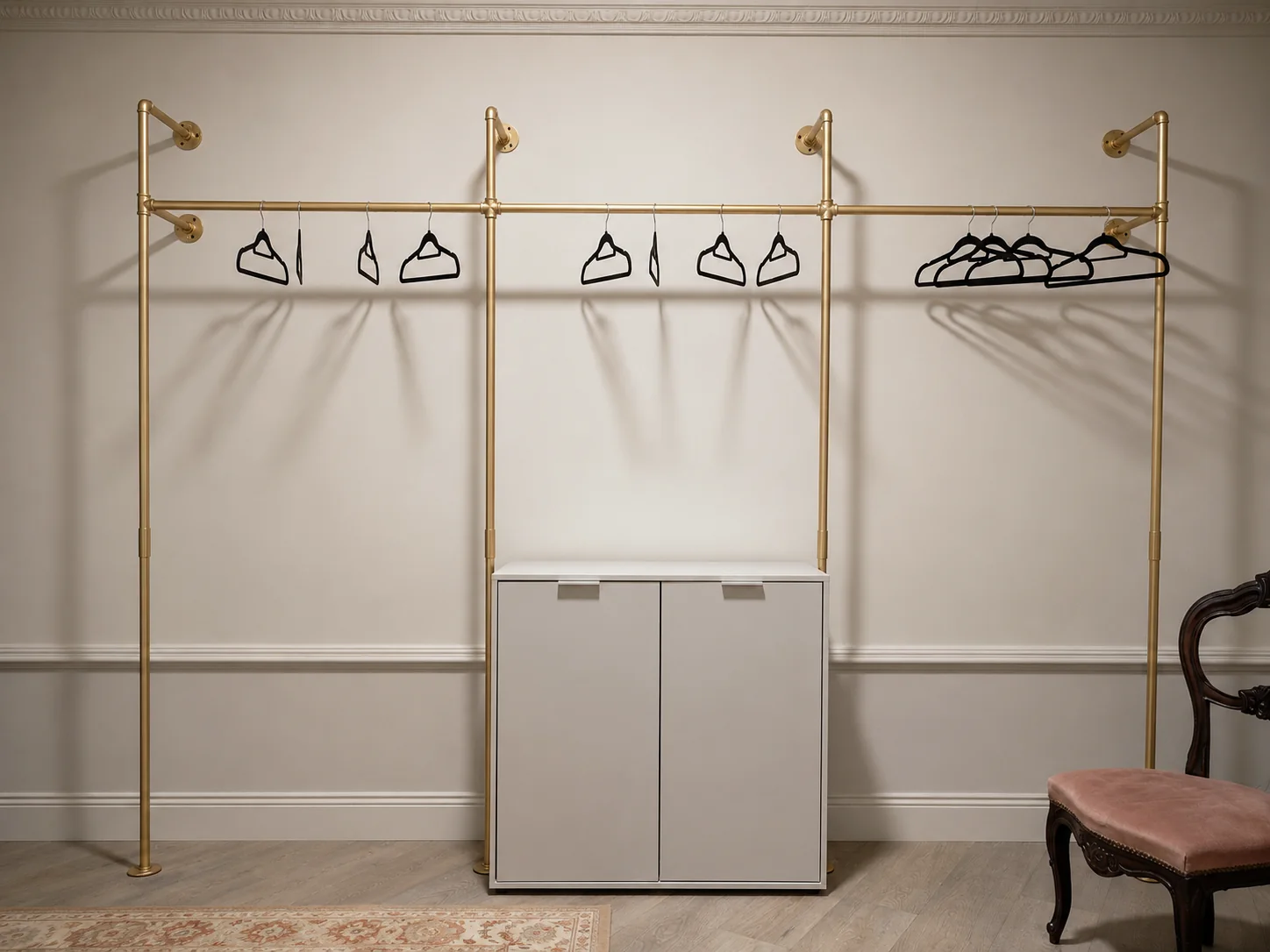 Walk-in wardrobe with open brass fittings