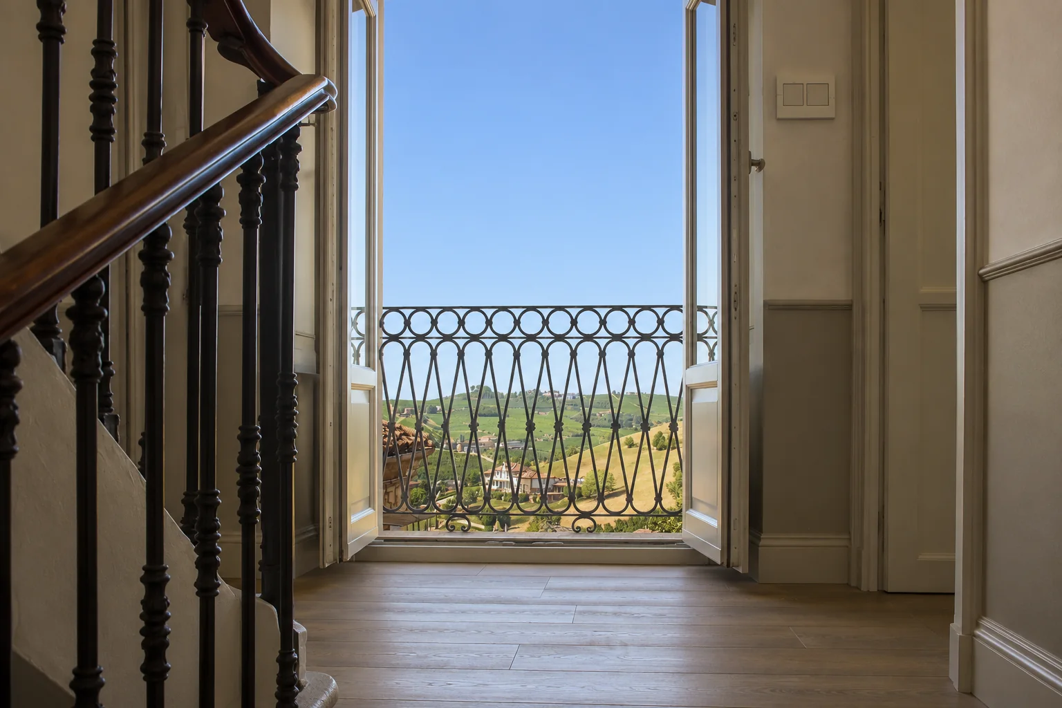 Landing opening onto a balcony and the surrounding landscape